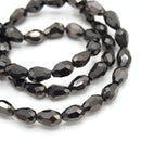 138 x Faceted Teardrop Glass Beads Metallic Jet - 4x6mm